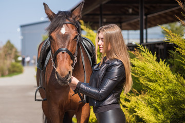 Obraz premium Girl with a horse, countryside place, woman talking to her horse. Portrait of riding horse with woman at rancho 