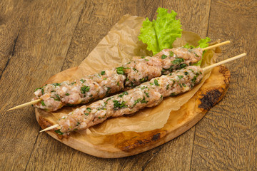 Raw minced pork skewer kebab for grill