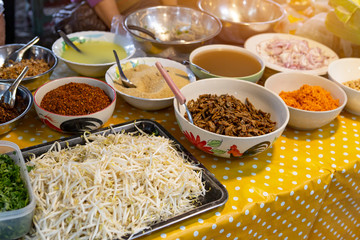 Thai style food stall at the market, Thai food demonstration, Thai spicy noodle salad ingredient display on the food stall at the market in Thailand 