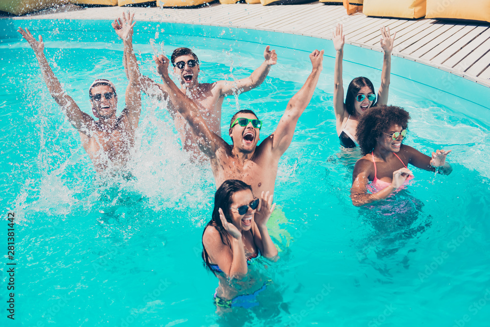 Poster Photo of six multinational friends fooling around in water enjoying best company and perfect sunny weather