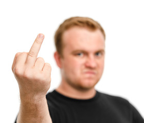 Aggressive man with blurred face showing fuck off sign with the middle finger isolated white...