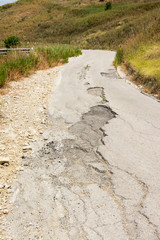 Big pothole on a national road in Sicily caused by landslide, carelessness and abandonment of road maintenance