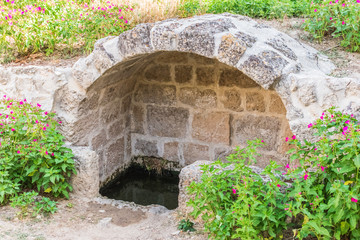 stone arch with water well