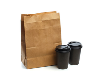 Paper bag on white background with coffee cup  Mockup for design .