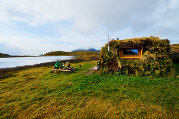 Wooden cabin covered with grass on Lofoten Islands in Norway