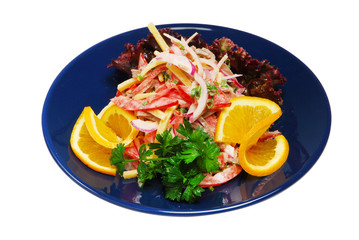 Salad with green on a plate on a white isolated background