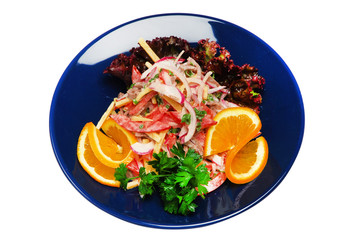 Salad with green on a plate on a white isolated background