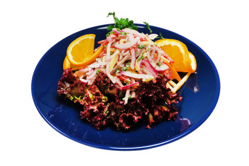 Salad with green on a plate on a white isolated background