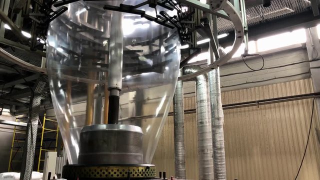 footage of plastic and flexible polymer packaging production; modern machinery and equipment; ocean pollution, production of waste, consumerism concept; waste recycling and reusability