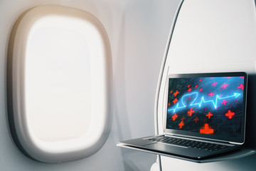 Laptop closeup inside airplane with heart health pic on screen. Medical education concept. 3d rendering.