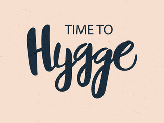 Vector illustration of hygge text for logo. Handwritten brush lettering for banner, logo, flayer, label, icon, badge, sticker. Dark isolated inscription on beige background with texture.