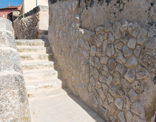 Typical village street with stone house in Spain