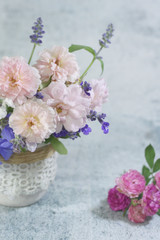 Naklejka na ściany i meble Beautiful rose flower vase background.