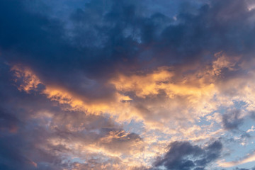 evening sky with clouds beautifully illuminated by the sun as a natural background