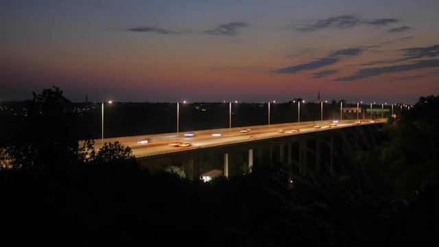 Time lapse of a sunset captured on a hill in Liljeholmen in Stockholm facing the motor highway Essingeleden.