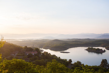 Fototapeta na wymiar Sunrise nature landscape, Slano lake (Slansko jezero) in Montenegro near Niksic, scenic panoramic aerial view