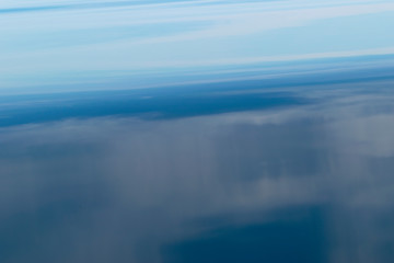 Water surface. View of a Crystal clear sea water texture. Landscape. Small waves. Water reflection