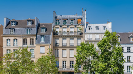 Fototapeta na wymiar Paris, typical buildings and roofs in the Marais, aerial view from the Pompidou Center