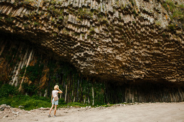 in armenia garni in the valley the antique organ basalt columns unique geological formation. Girl...