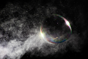 Steam jet and soap bubble and highlight is close