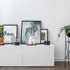 White sideboard and flower stand