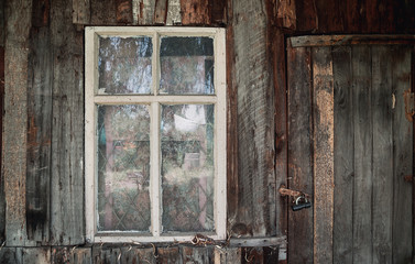 Vintage rural wooden wall with window and door