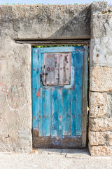 wooden door entrance on stone wall