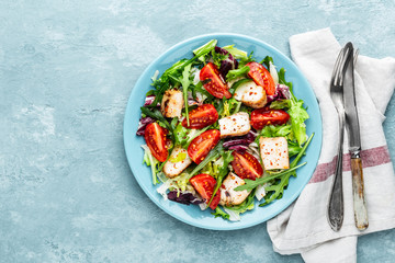 chicken breast salad with fresh vegetables top view and space for a text