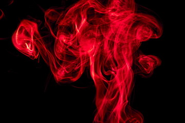 Red smoke on black background