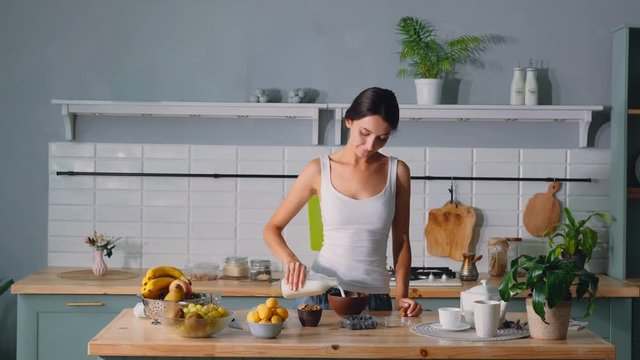 Young woman making healthy breakfast