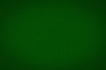 Texture of real dark green knitwear, textile background. Abstract background