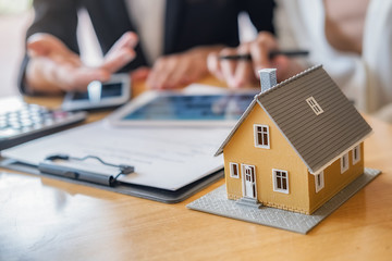 Saving money to invest in house or property in the future. Business Finance Concept.