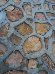 Path of plated stones with cement in Garden. Meditative stone walkway. Garden architecture, pathway accessory