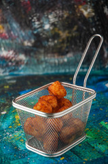 fried cheese balls in a grid on the table