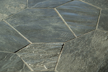 an interior with a patternless stone floor background