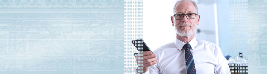 Portrait of senior businessman holding his mobile phone; panoramic banner