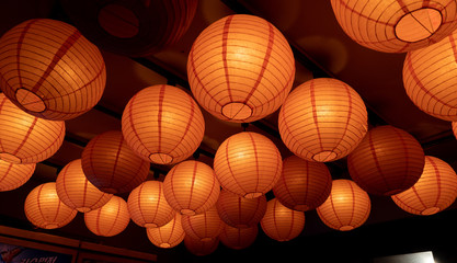 a round, bright orange lantern