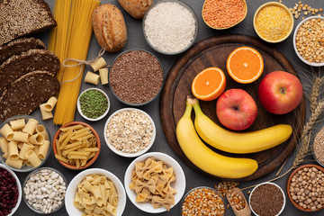 Gluten free grains, bread, pasta and fruits on wood