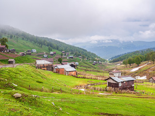 Fototapeta na wymiar Beautiful landscape in Georgia with shabby cabins of Goderdzi pass