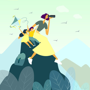 Happy mother hiking with her children in mountains