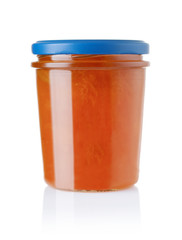 Apricot jam in a glass jar isolated on white
