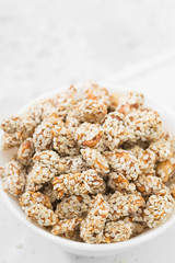 Peanuts roasted in honey and sesame seeds. Rustic style