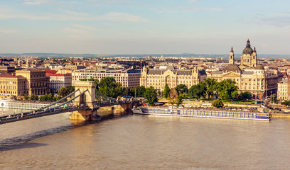 Budapest, Hungary - June 2019. Danube river in the city of Budapest. You can see the river life and the historical building in the background.