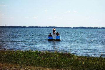 Fototapeta na wymiar Young people have fun on a water bike