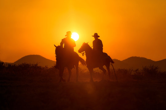 รหัสภาพถ่ายสต็อกปลอดค่าลิขสิทธิ์: 1466408231 Cowboys are riding horses silhouette in sunset with mountain scene in Pakchong, Nakhonratchasima, Thailand