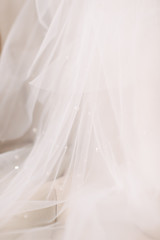 white veil with pearls close up. Fine art