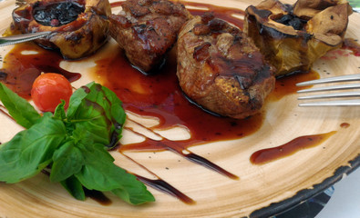 baked duck fillet with raspberry sauce on a plate