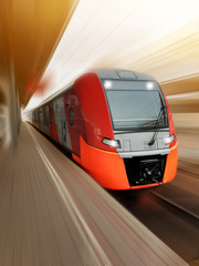 high-speed red passenger train passes railway platform