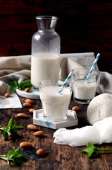 Almond milk on a dark wooden table