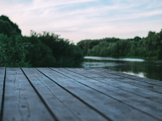 Wooden bridge on the banks of the river background
